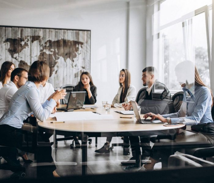 Group of people working out business plan in an office